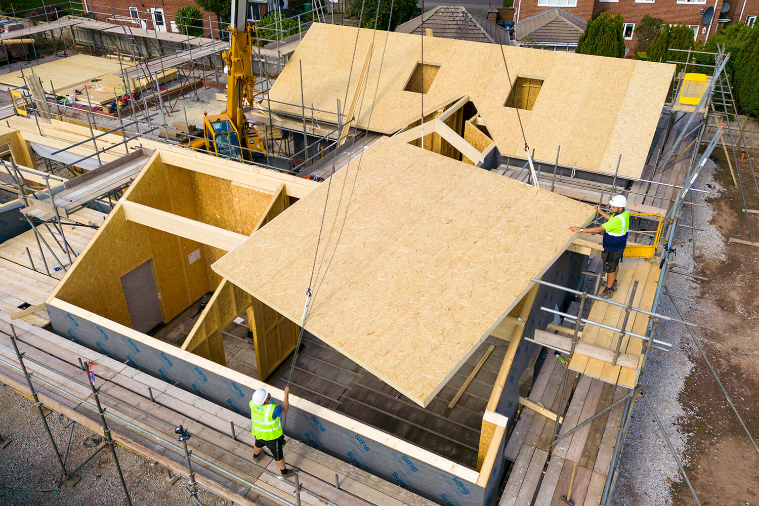 drone view of a crane lift at a construction site 